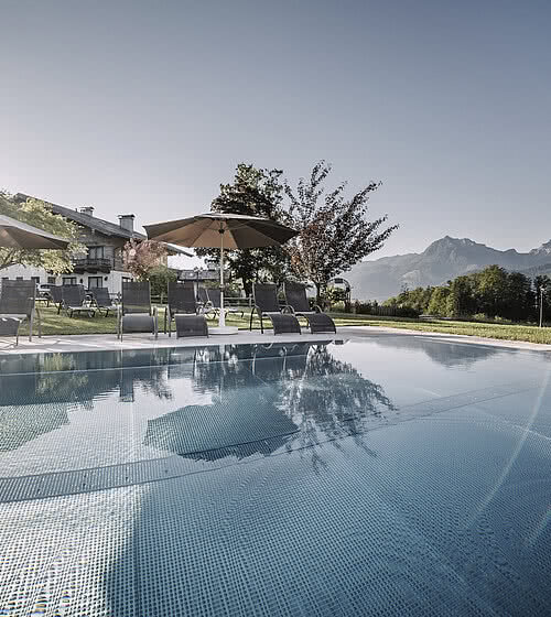Heated outdoor pools with views to Wolfgangsee and the mountains