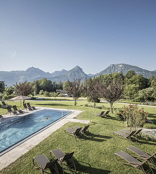 Heated outdoor pools with views to Wolfgangsee and the mountains
