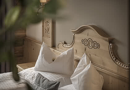 Kuscheliges Bett im 4 Sterne Hotel Bachmanngut am Wolfgangsee