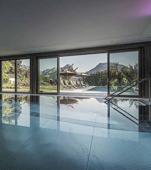 Indoor pool with garden view in the wellness hotel Das Bachmanngut