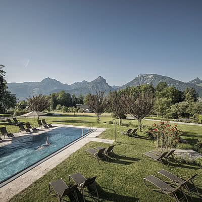 Heated outdoor pools with views to Wolfgangsee and the mountains